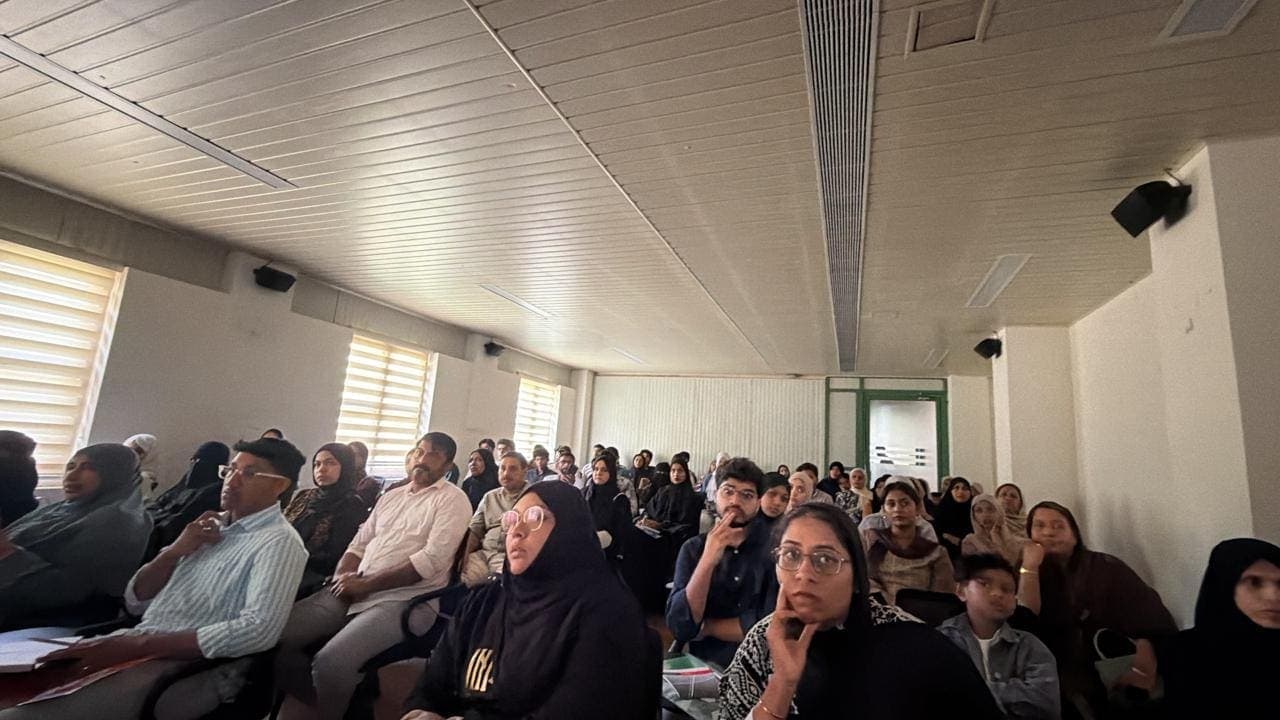 An audience of students and families at a TIIB talk